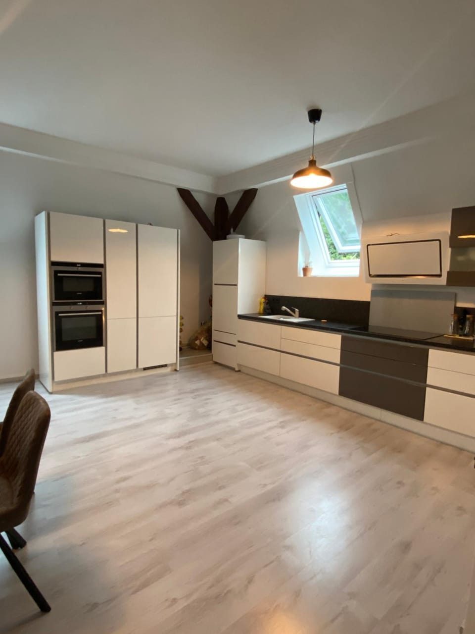 Kitchen or kitchenette, dishwasher, oven, stove