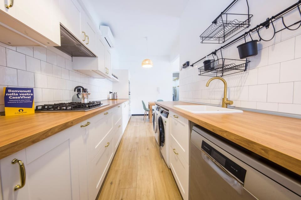 Kitchen or kitchenette, dishwasher, oven, stove