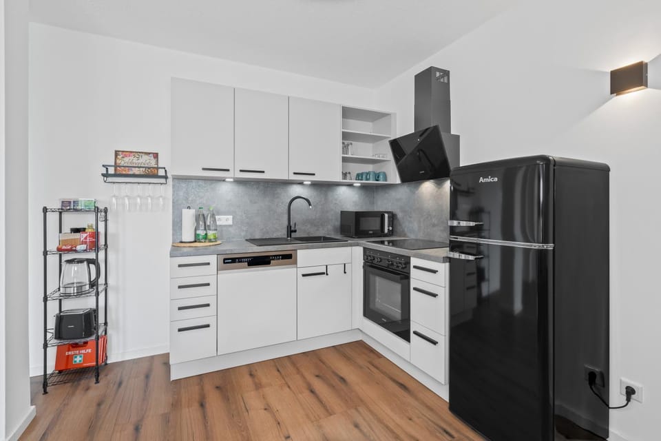 Kitchen or kitchenette, dishwasher, microwave, oven, stove, toaster
