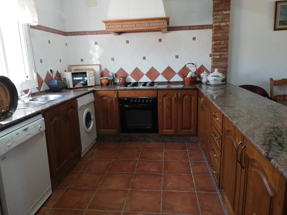 Kitchen or kitchenette, dishwasher, oven, stove