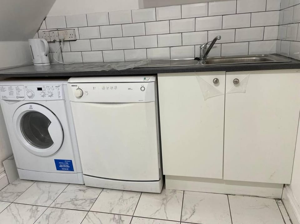 Kitchen or kitchenette, dishwasher, washing machine, dryer