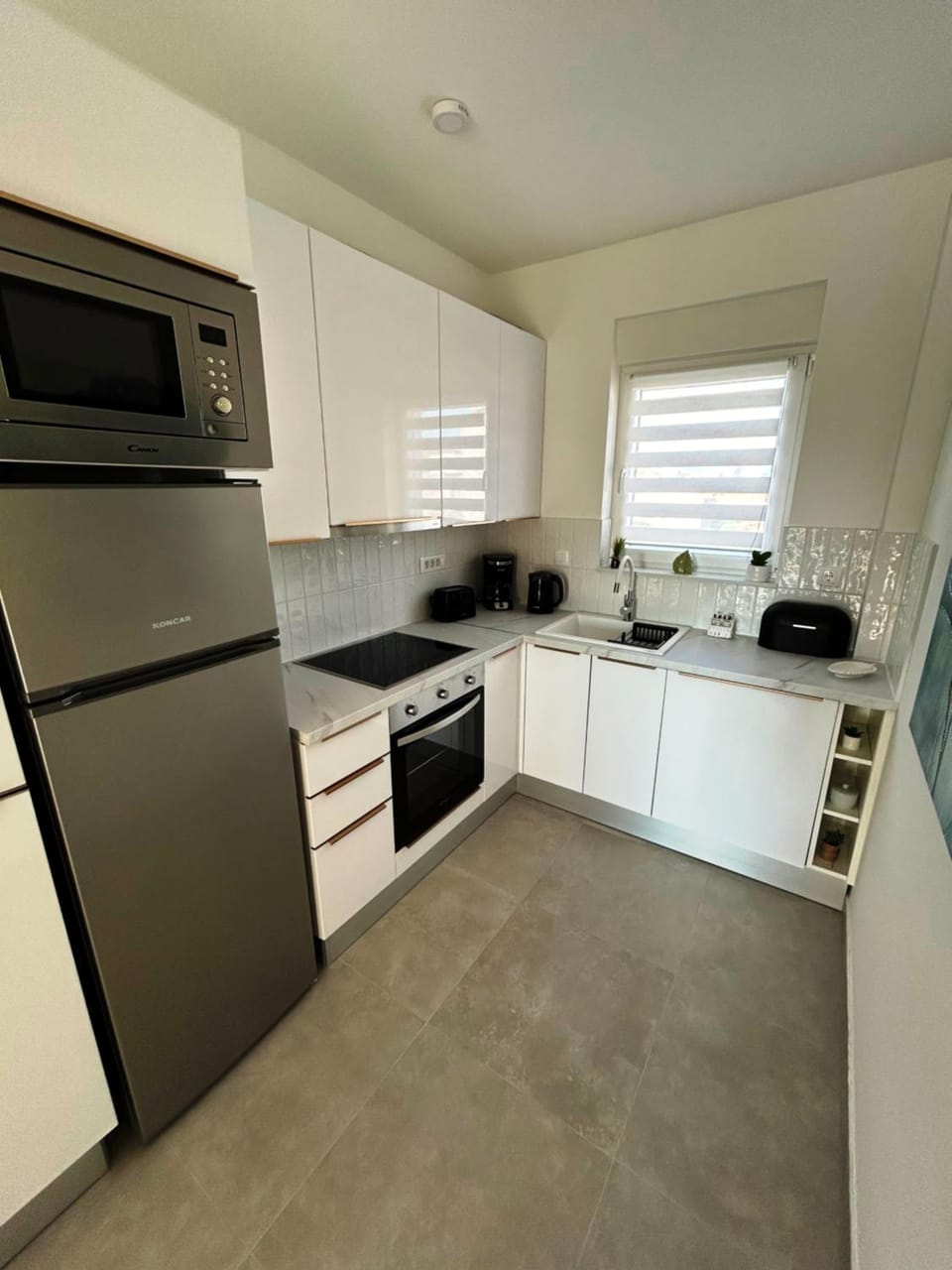 Kitchen or kitchenette, dishwasher, oven, stove, toaster