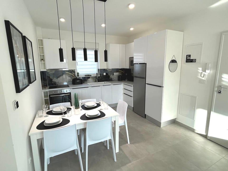 Kitchen or kitchenette, dishwasher, oven, stove, toaster