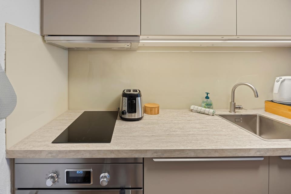 Kitchen or kitchenette, stove, toaster