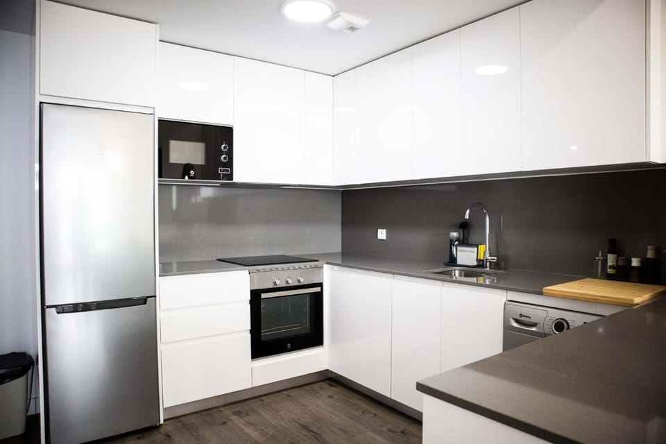 Kitchen or kitchenette, dishwasher, oven, stove, toaster