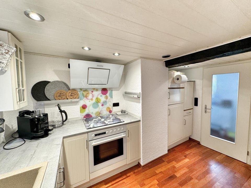 Kitchen or kitchenette, dishwasher, oven, stove, toaster