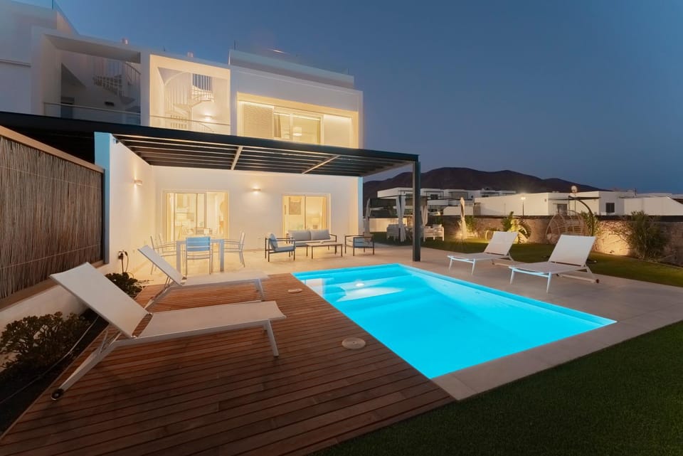 Property building, Patio, Night, Balcony/Terrace, Pool view, Swimming pool, sunbed