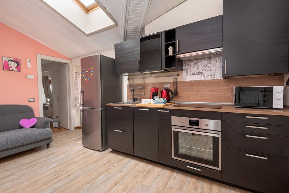 Kitchen or kitchenette, dishwasher, oven, stove