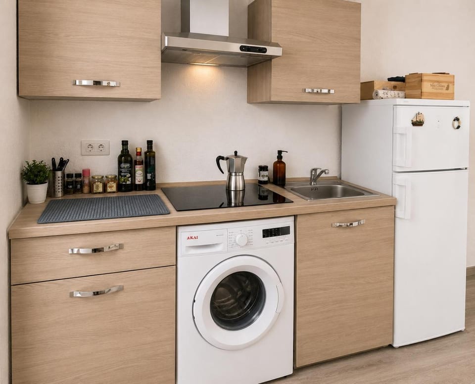 Kitchen or kitchenette, stove, washing machine