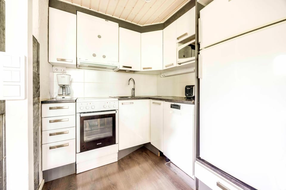 Kitchen or kitchenette, dishwasher, oven, stove, toaster