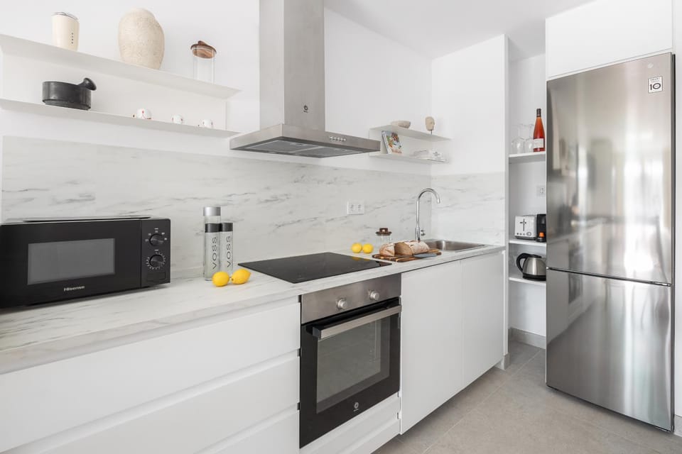 Kitchen or kitchenette, dishwasher, oven, stove, toaster