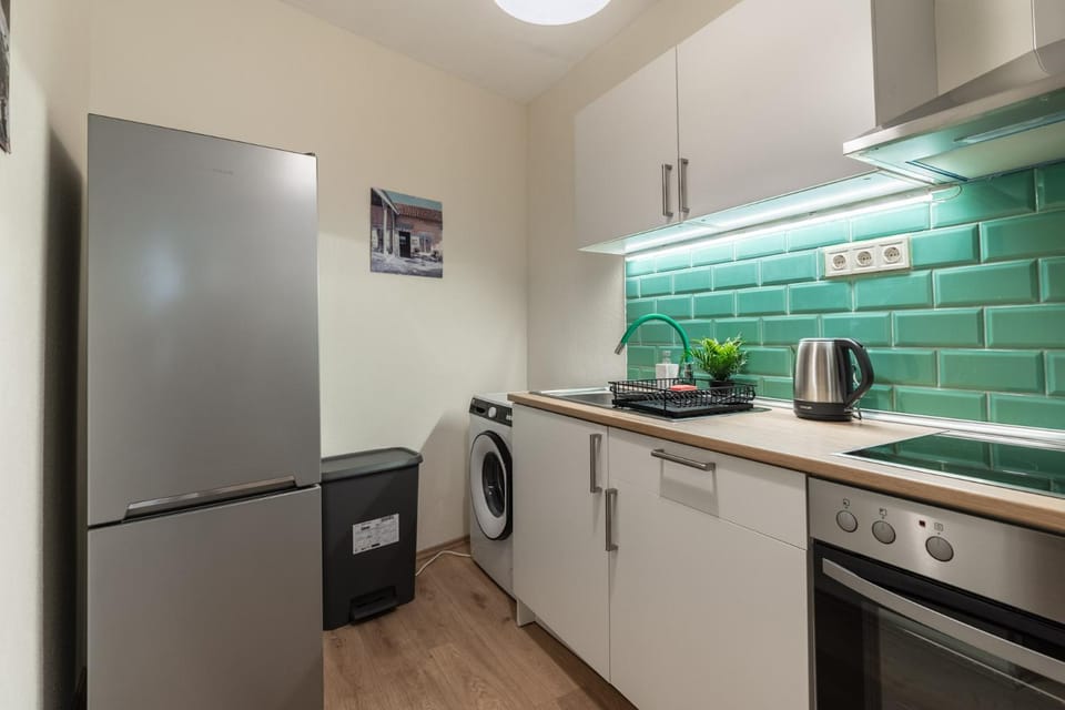 Kitchen or kitchenette, dishwasher, oven, stove, toaster, washing machine