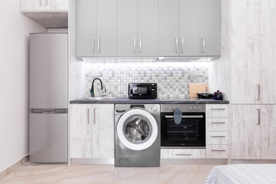 Kitchen or kitchenette, oven, stove, washing machine