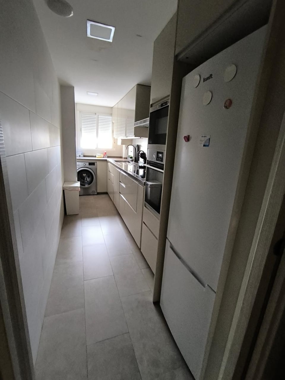 Kitchen or kitchenette, dishwasher, oven, stove, washing machine
