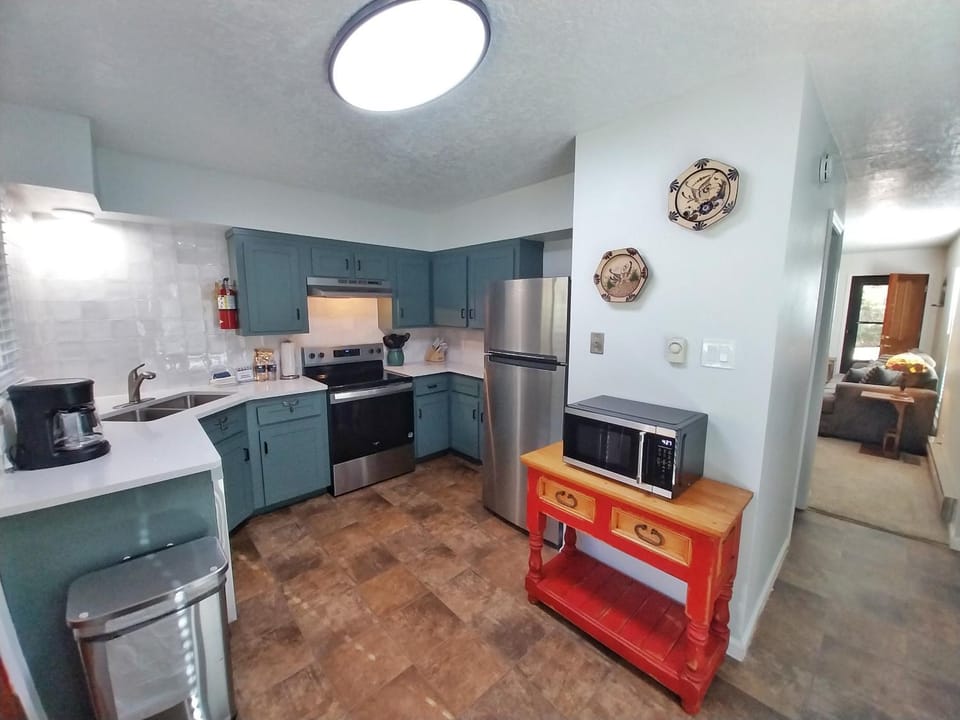 Kitchen or kitchenette, furniture, microwave, oven, stove, kitchen