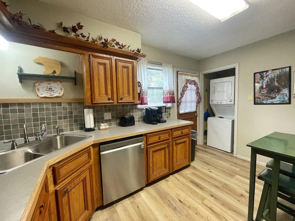 Kitchen or kitchenette, dishwasher, furniture, laundry, washing machine, dryer, kitchen