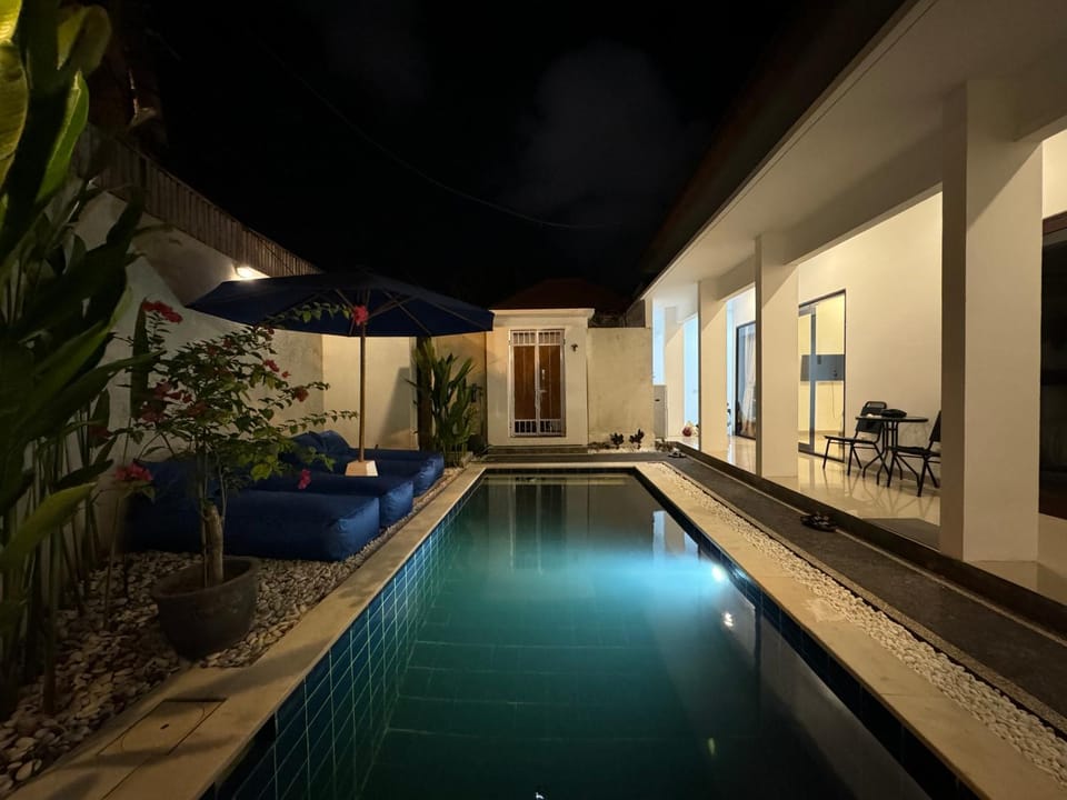 Patio, Night, Pool view, Swimming pool, sunbed