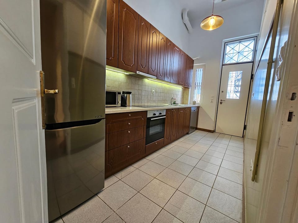 Kitchen or kitchenette, dishwasher, oven, stove