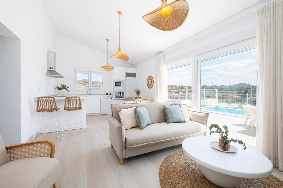 Kitchen or kitchenette, Living room, Seating area, Dining area, Pool view
