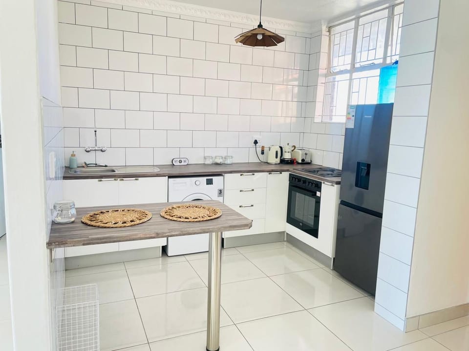 Kitchen or kitchenette, dishwasher, oven, stove