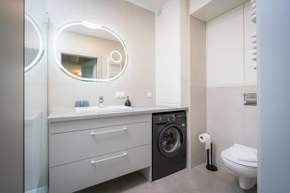 Shower, Toilet, Bathroom, towels, washing machine, dryer