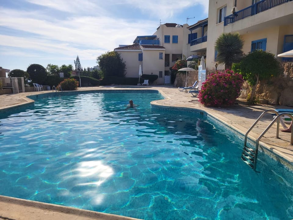 Property building, Pool view, Swimming pool, sunbed