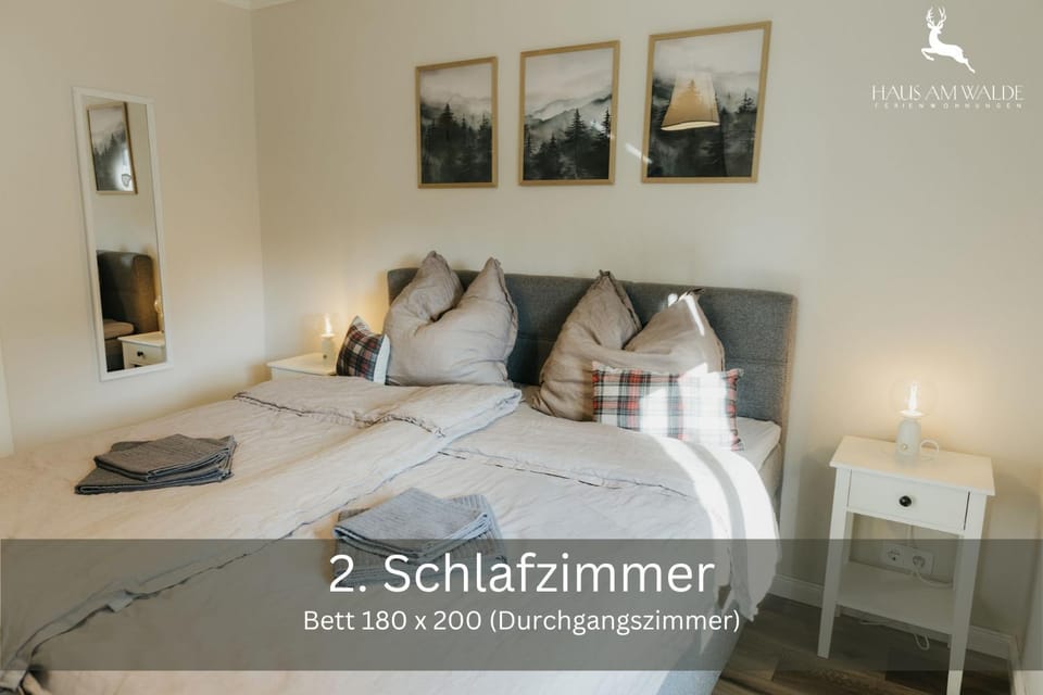 Bed, Photo of the whole room, Bedroom, Text overlay, towels