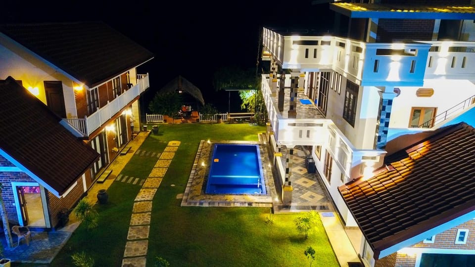 Patio, Night, Pool view, Swimming pool, sunbed