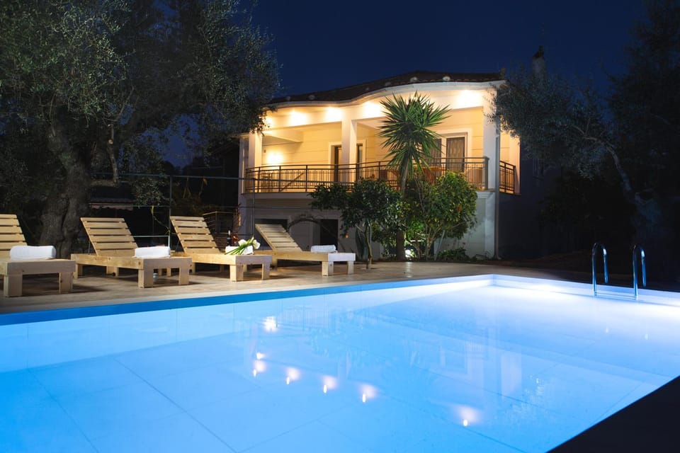 Property building, Patio, Night, Pool view, Swimming pool, sunbed