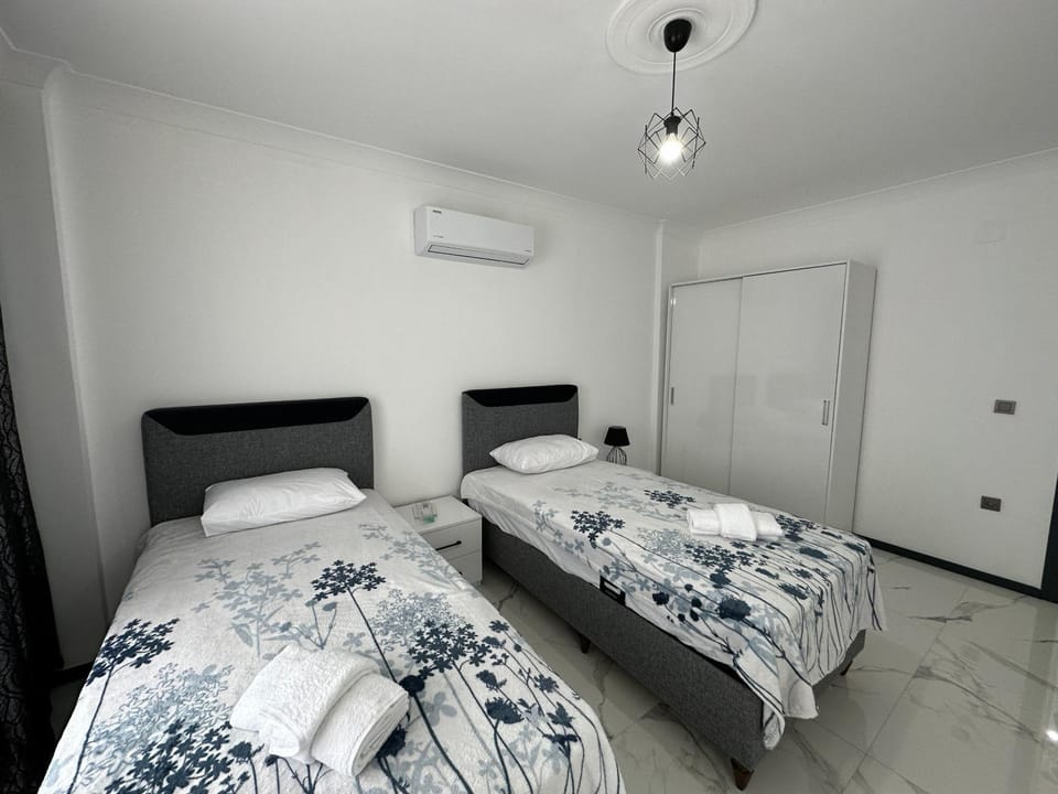 Bed, Photo of the whole room, Bedroom, towels, air conditioner