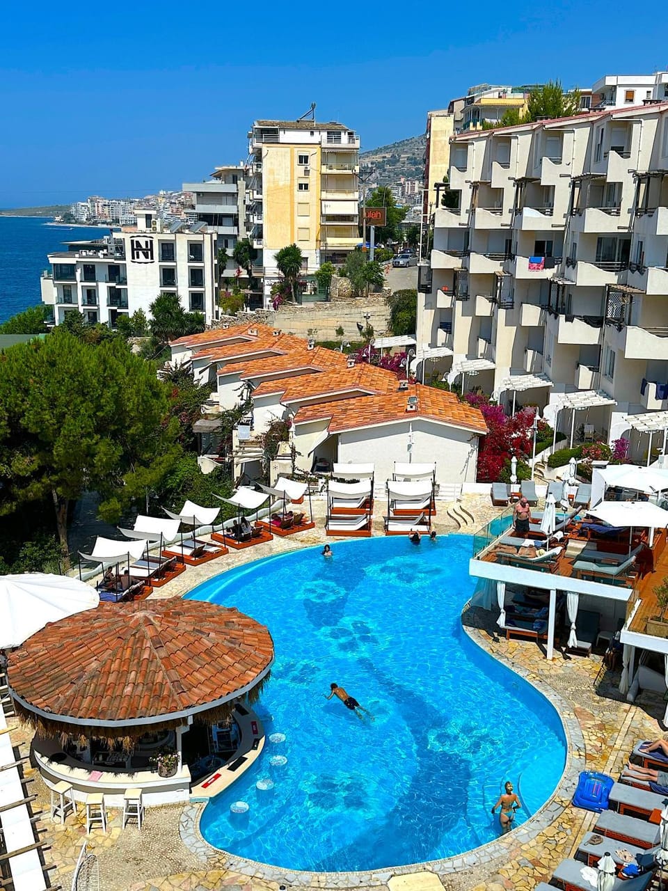 Property building, Day, Beach, Pool view, Sea view, Swimming pool, Location, sunbed