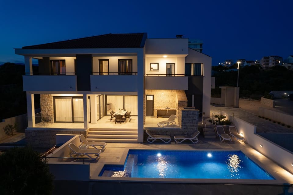 Property building, Patio, Night, Pool view, Swimming pool, sunbed