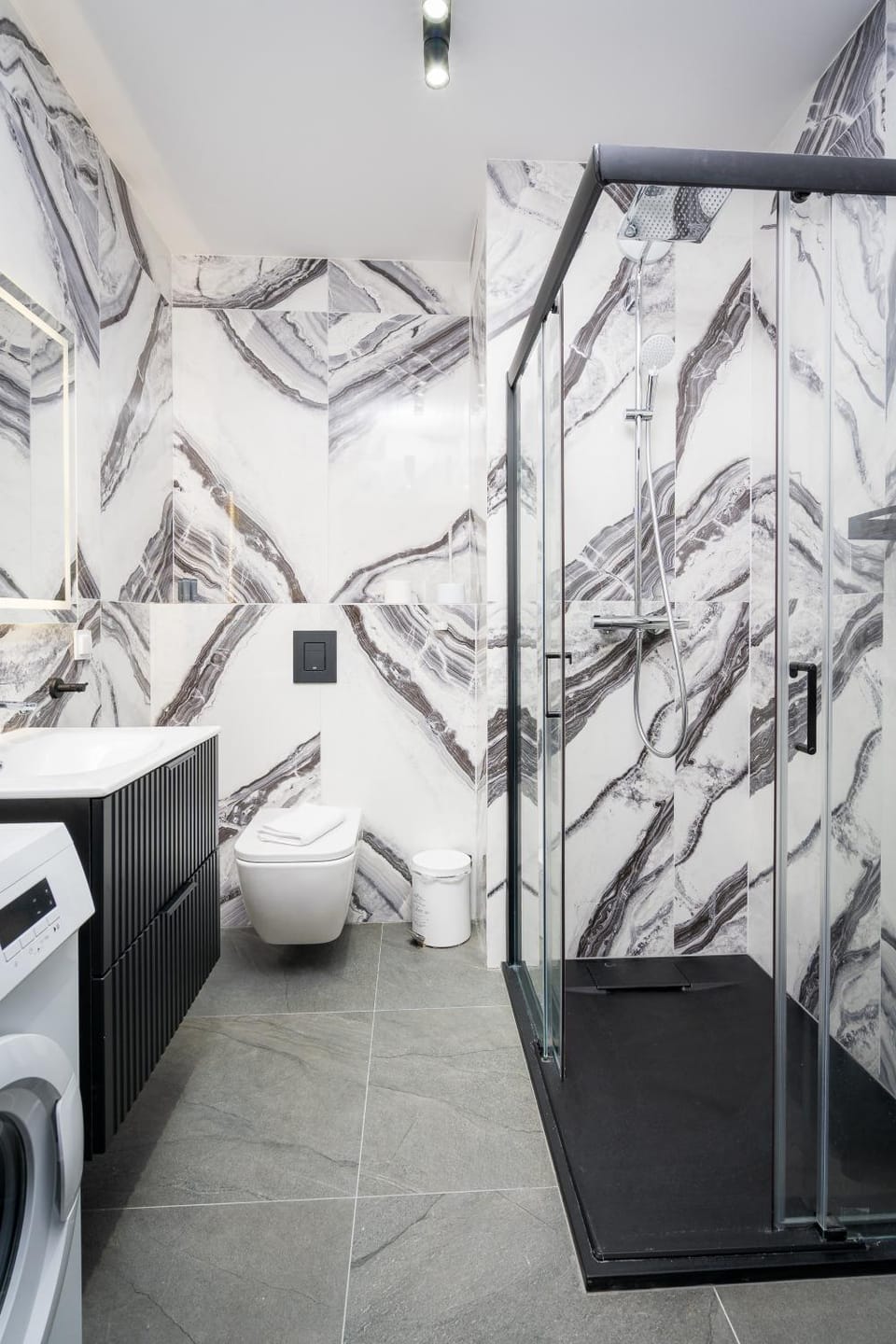 Shower, Toilet, hair dryier, towels, washing machine