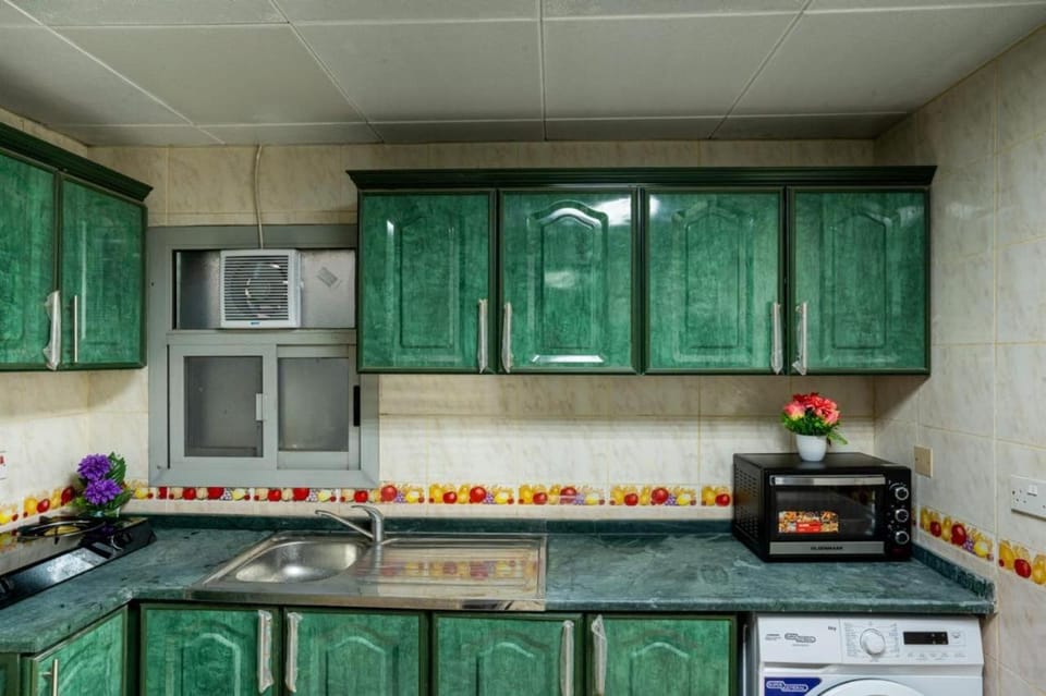 Kitchen or kitchenette, oven