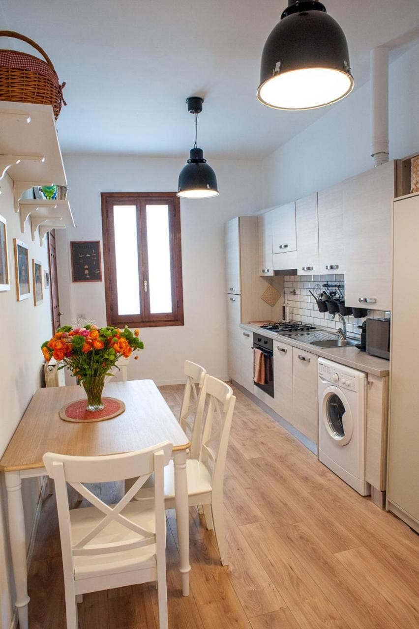 Kitchen or kitchenette, Dining area, microwave, oven, stove, washing machine