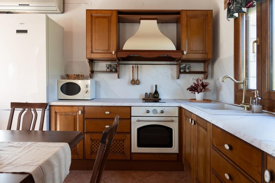 Kitchen or kitchenette, oven, stove, air conditioner