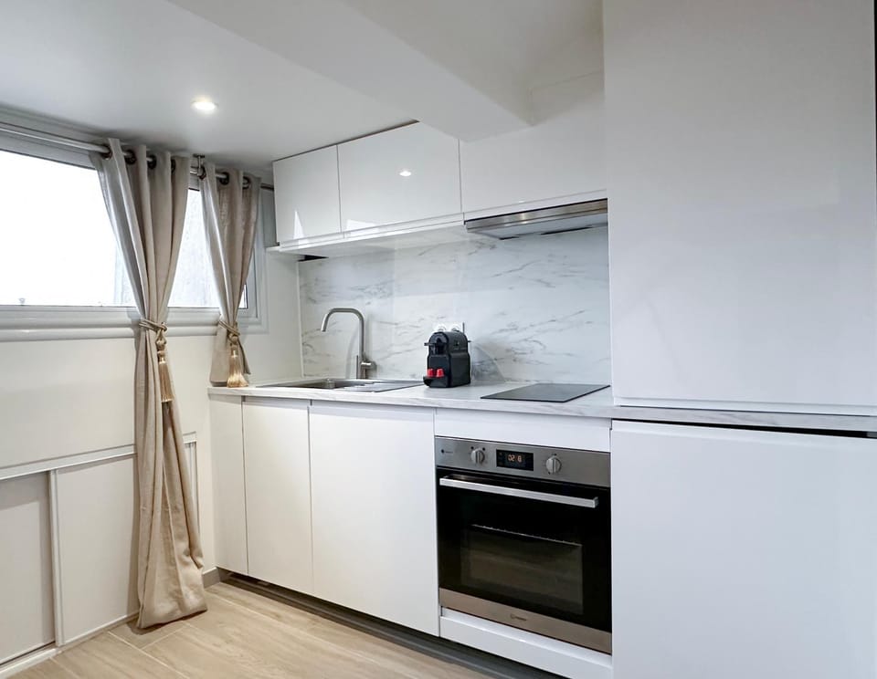 Kitchen or kitchenette, microwave, oven, stove, toaster, washing machine, dryer, kitchen