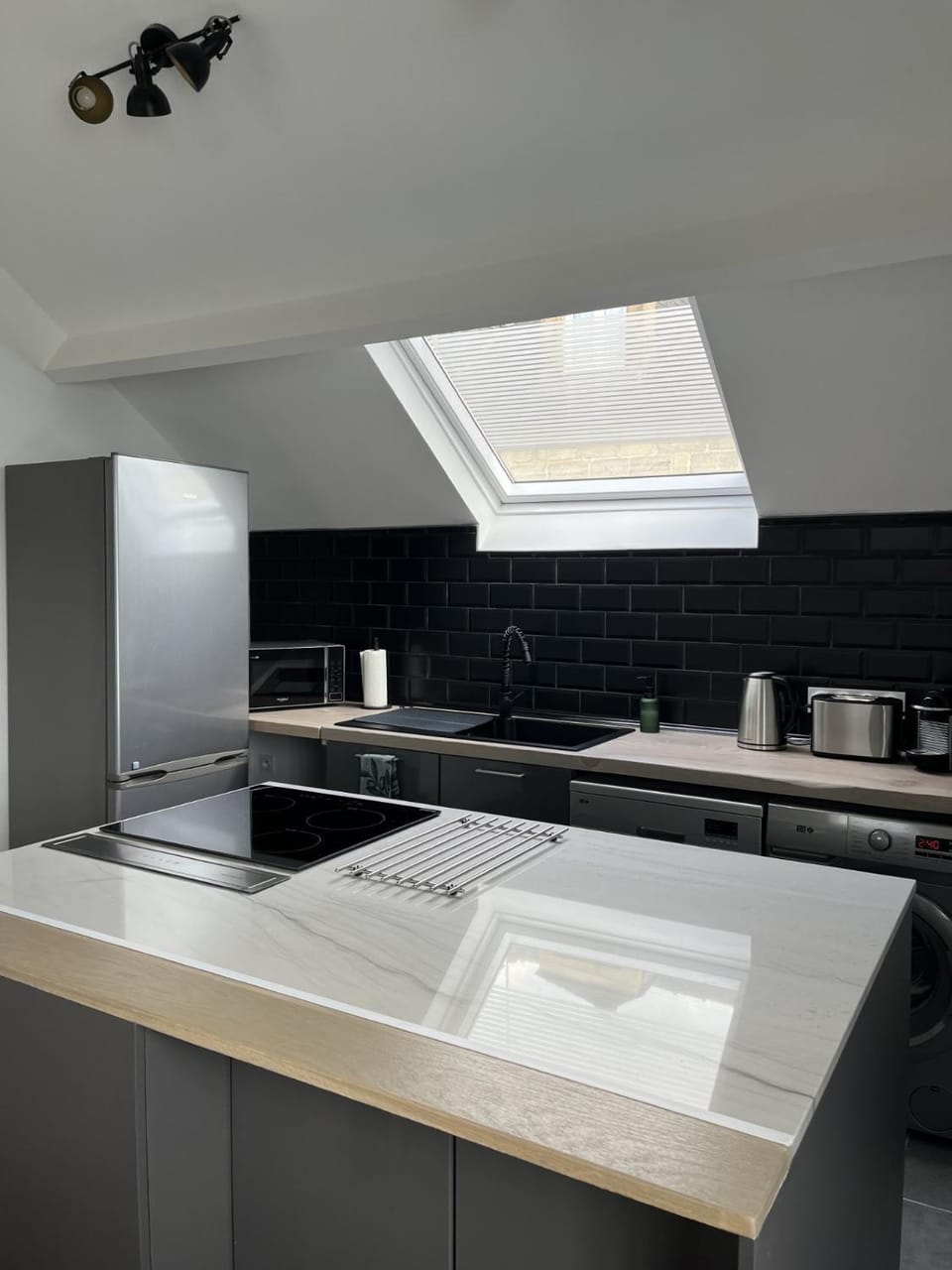 Kitchen or kitchenette, dishwasher, oven, stove