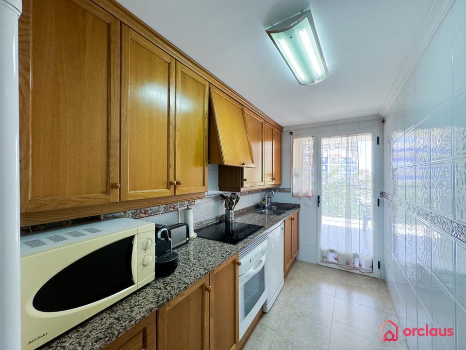 Kitchen or kitchenette, dishwasher, oven, stove, toaster