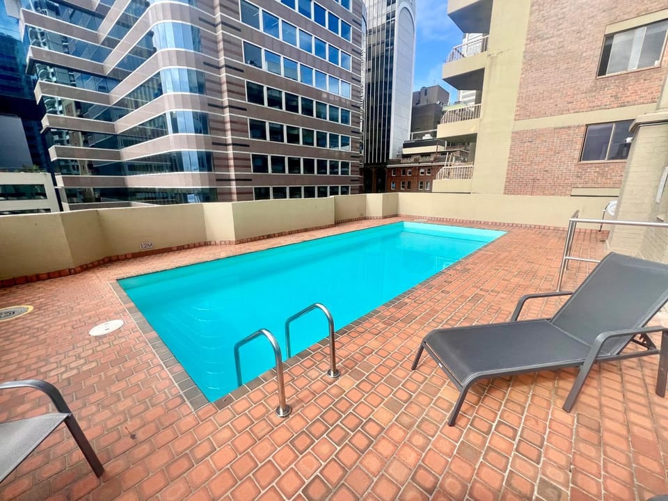 Property building, Patio, Day, Pool view, Swimming pool, sunbed