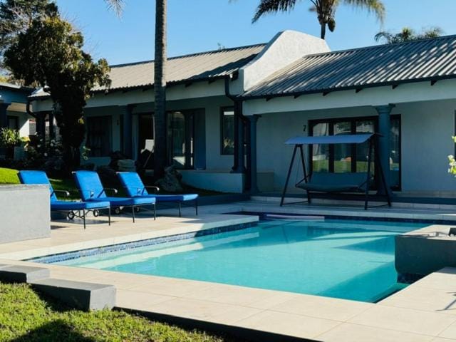 Property building, Day, Pool view, Swimming pool, sunbed