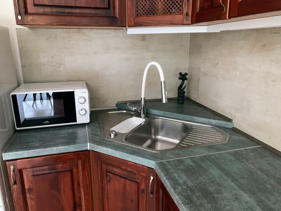 Kitchen or kitchenette, microwave