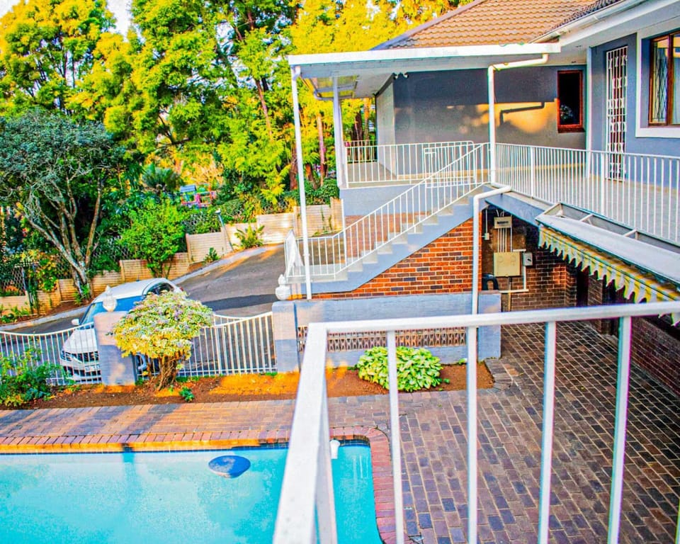 Property building, Patio, Spring, Day, Garden, View (from property/room), Balcony/Terrace, Garden view, Pool view, Swimming pool