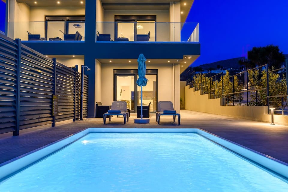 Shower, Property building, Patio, Night, View (from property/room), Balcony/Terrace, Pool view, Swimming pool, sunbed