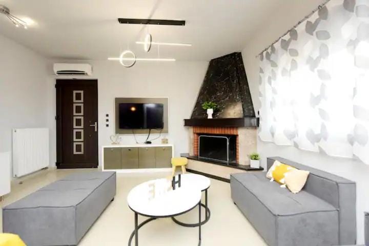 TV and multimedia, Living room, Seating area, fireplace, air conditioner