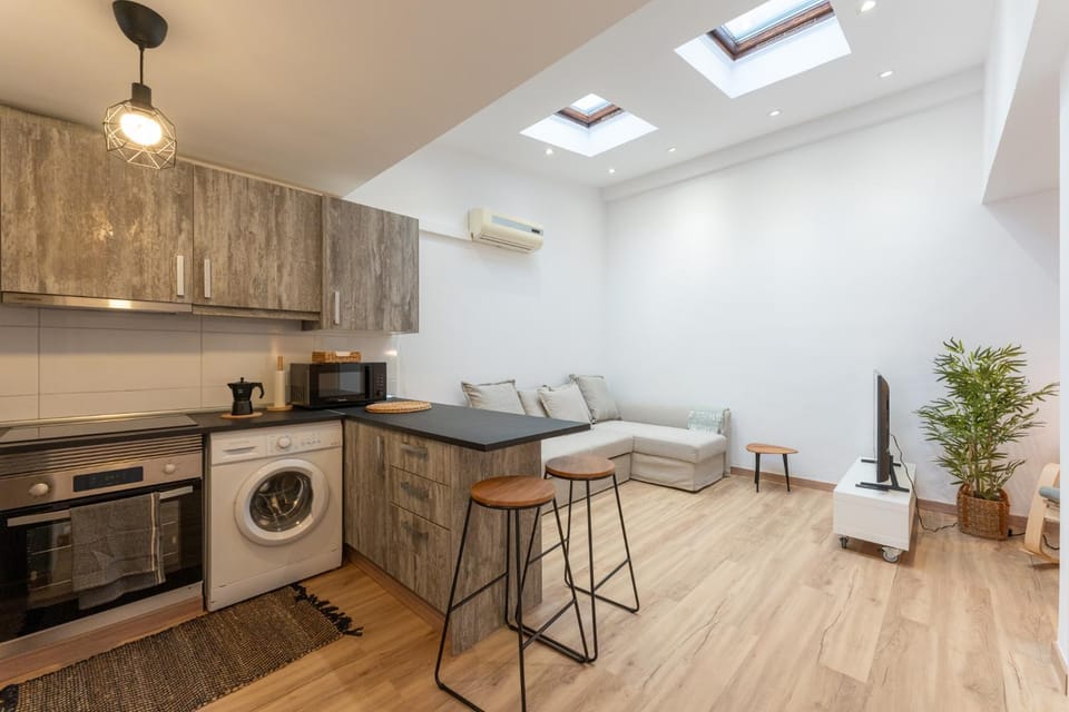 Living room, Seating area, Dining area, oven, stove, toaster, washing machine, kitchen