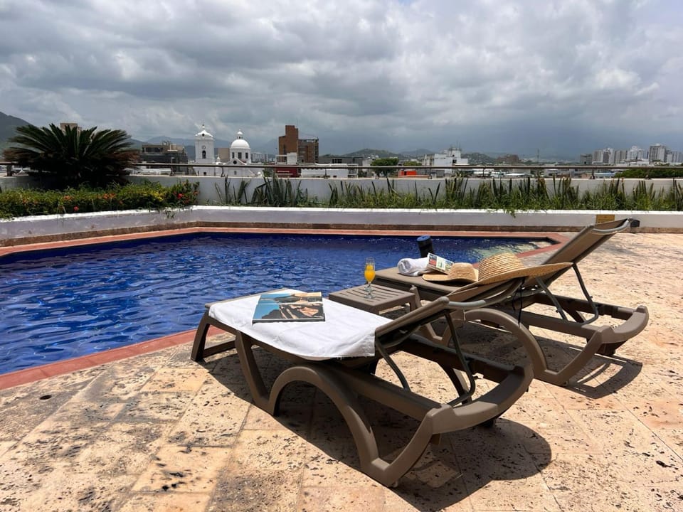 Patio, Day, Natural landscape, Balcony/Terrace, Living room, Seating area, Dining area, City view, Landmark view, Pool view, Street view, Swimming pool, sunbed