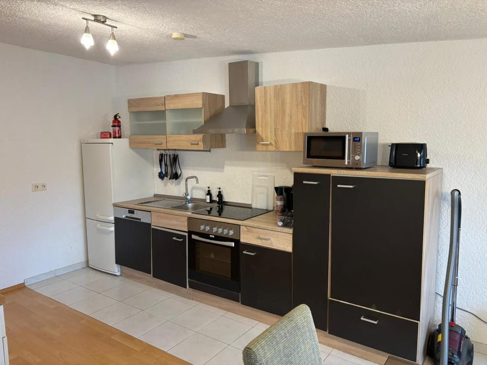 Kitchen or kitchenette, dishwasher, oven, stove, toaster