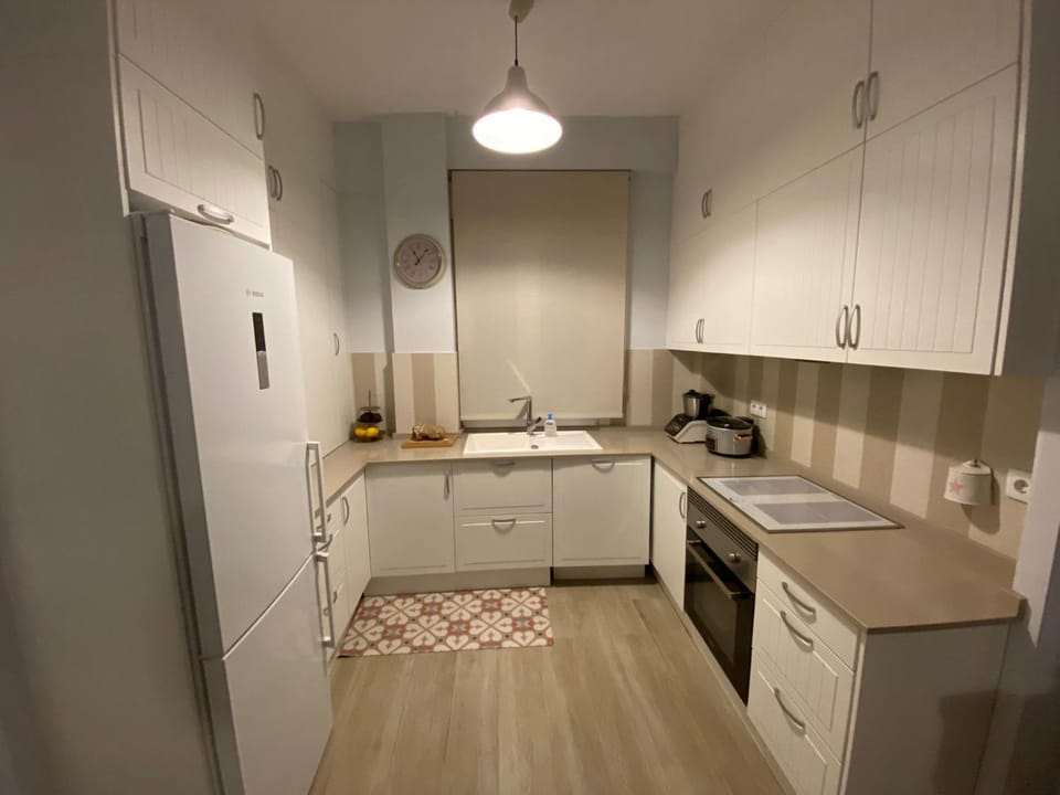 Kitchen or kitchenette, dishwasher, oven, stove