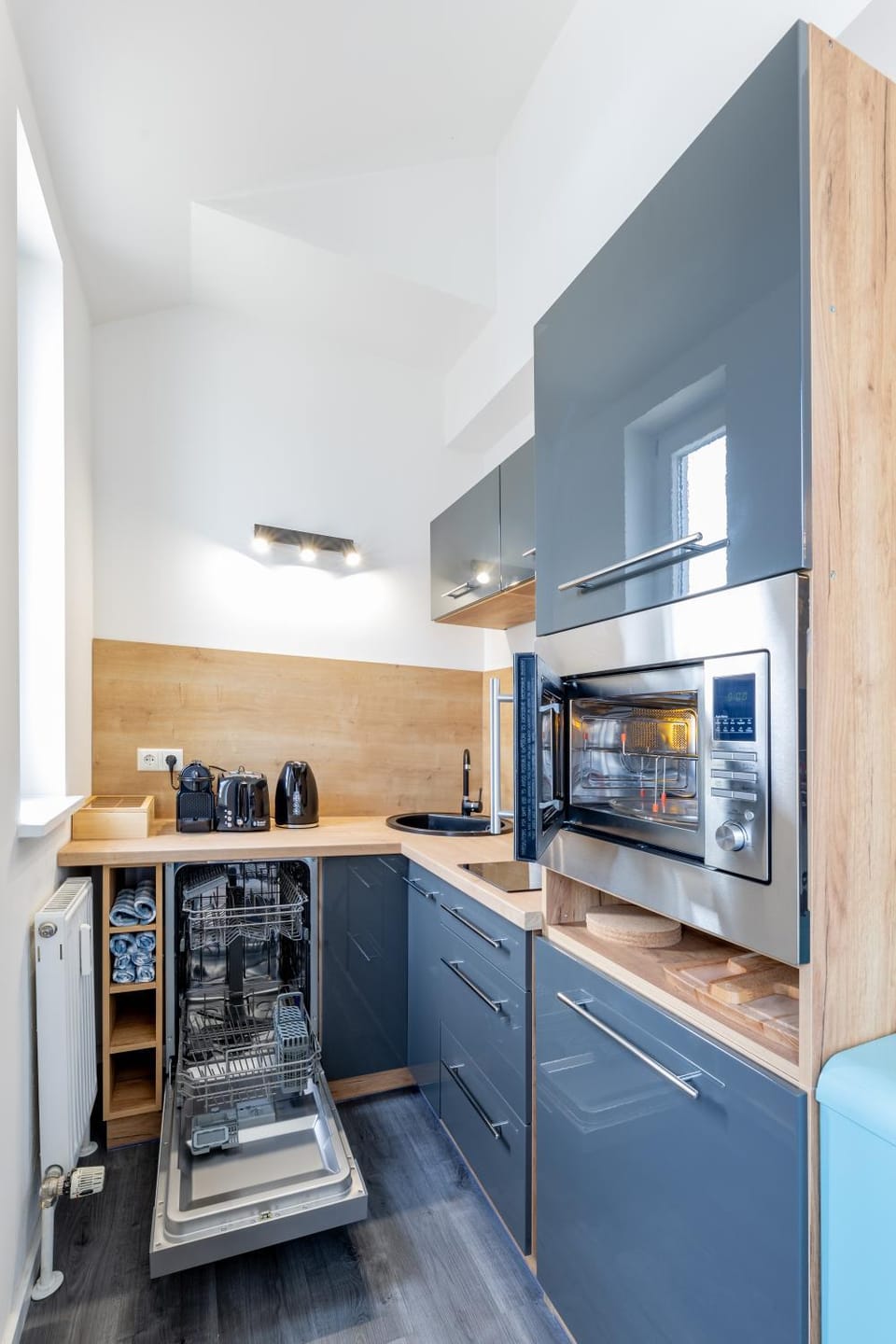 Kitchen or kitchenette, dishwasher, microwave, stove, toaster